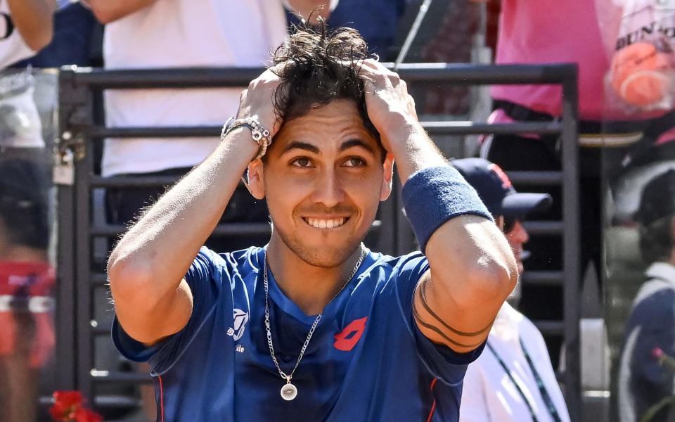 Alejandro Tabilo of Chile celebrates after winning against Novak Djokovic of Serbia
