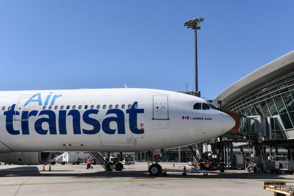 An Air Transat Airbus A330 parked at Lyon Saint-Exupery Airport.