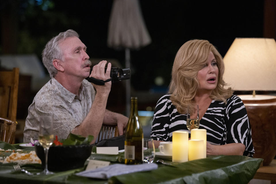 This image released by Lionsgate shows Steve Coulter, left, and Jennifer Coolidge in a scene from "Shotgun Wedding." (Ana Carballosa/Lionsgate via AP)