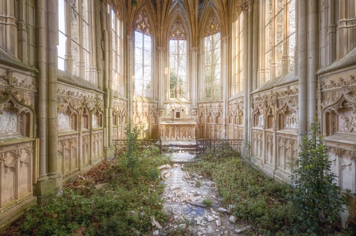 <p>Nature has found its way into the nave of this Gothic church. (Photo: Roman Robroek/Caters News) </p>