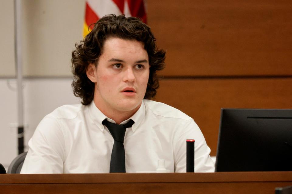 Former MSD student Justin Colton on the witness stand during the penalty phase of shooter Nikolas Cruz at the Broward County Courthouse in Fort Lauderdale on Monday, July 25, 2022. Cruz previously plead guilty to all 17 counts of premeditated murder and 17 counts of attempted murder in the 2018 shootings