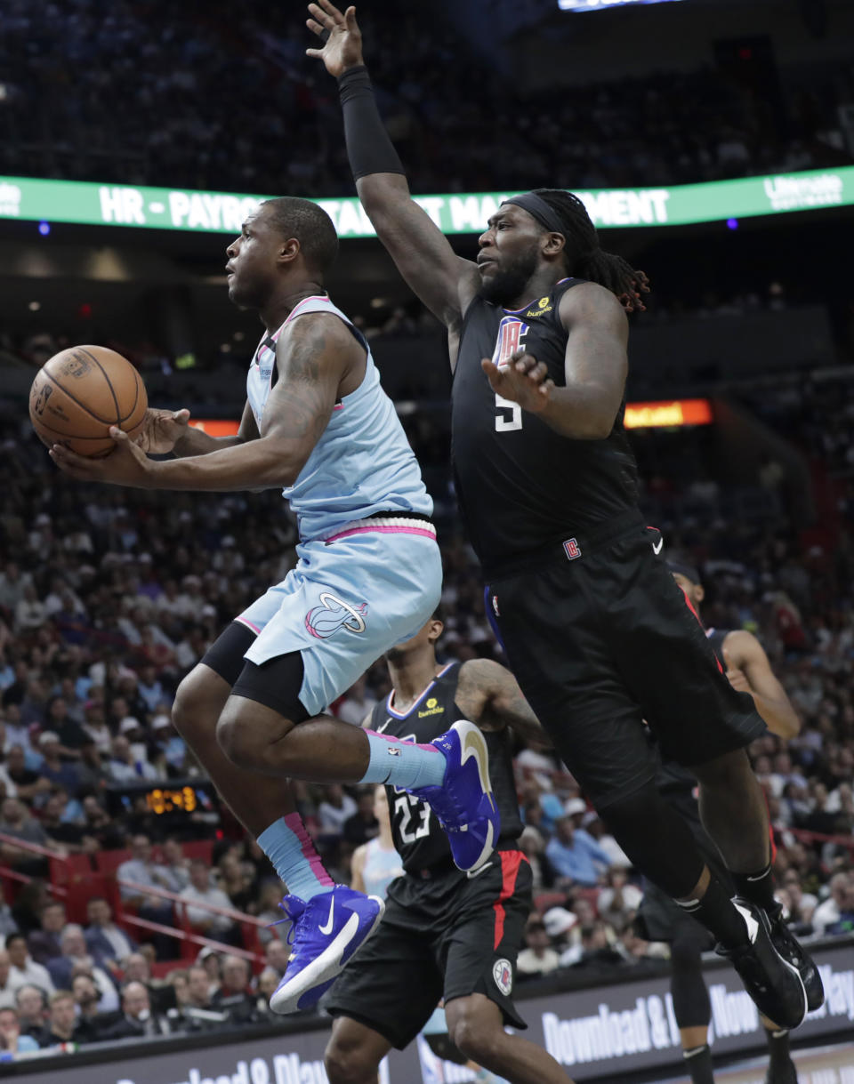 Miami Heat guard Dion Waiters goes to the basket as Los Angeles Clippers forward Montrezl Harrell (5) defends during the second half of an NBA basketball game, Friday, Jan. 24, 2020, in Miami. (AP Photo/Lynne Sladky)