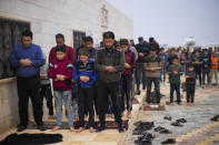 Syrians pray in a refugee camp for displaced people run by the Turkish Red Crescent in Sarmada district on the outskirts north of Idlib, Syria, Friday, Nov. 26, 2021. In this opposition-held town near the border with Turkey, thousands of displaced Syrians go about their daily lives with little hope of returning home any time soon. (AP Photo/Francisco Seco)