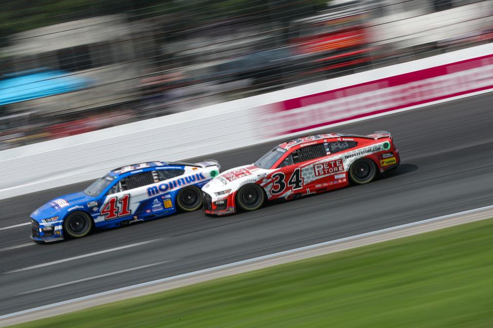 Michael McDowell (34) took responsibility for a late run in with Ryan Preece (41) during Monday's race at New Hampshire.