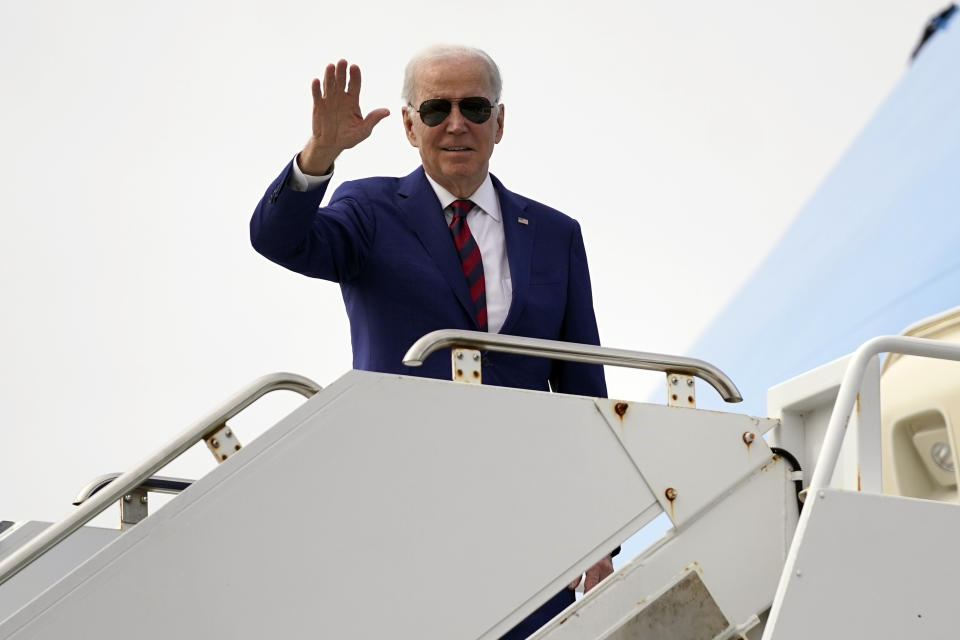 President Joe Biden waves as he boards Air Force One at North Island Naval Air Station, Tuesday, March 14, 2023, in San Diego. (AP Photo/Evan Vucci)