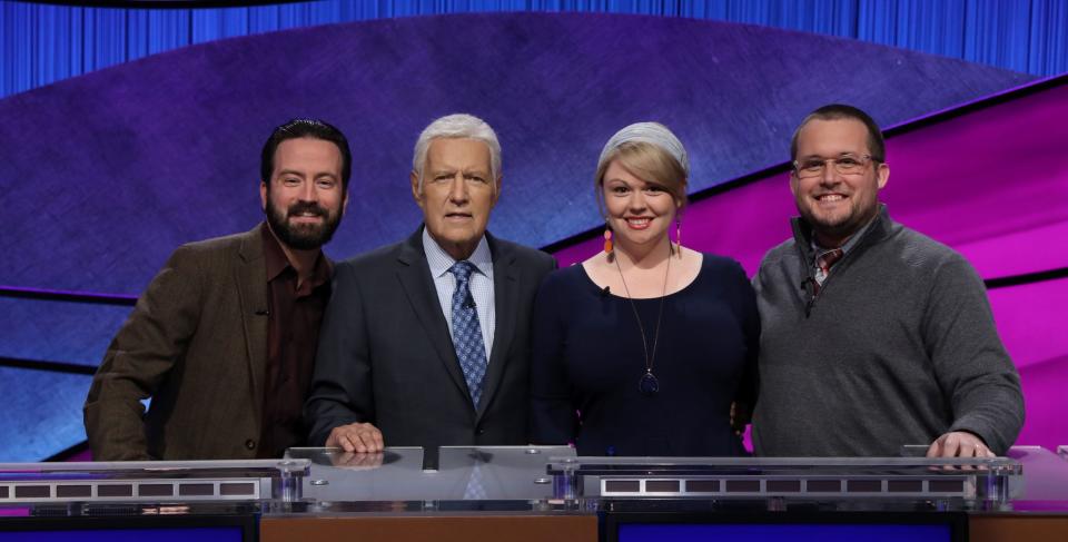 Jeopardy! finalists Ben Henri, Meggie Kwait and Will Satterwhite post with host Alex Trebek.