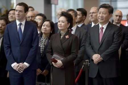 Britain's Chancellor George Osborne (L) lines up with and China's President Xi Jinping and his wife Peng Liyuan, during a visit to Imperial College in London, Britain October 21, 2015. REUTERS/Anthony Devlin/pool