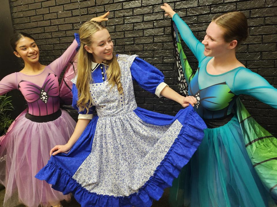 From left, Sofia Ali, portraying a butterfly, Eden Holmes, portraying Alice, and Emma Pittman, portraying a butterfly, prepare for the upcoming production of Lone Star Ballet's "Alice in Wonderland." The production will be held April 14-15 at the Globe-News Center for the Performing Arts.