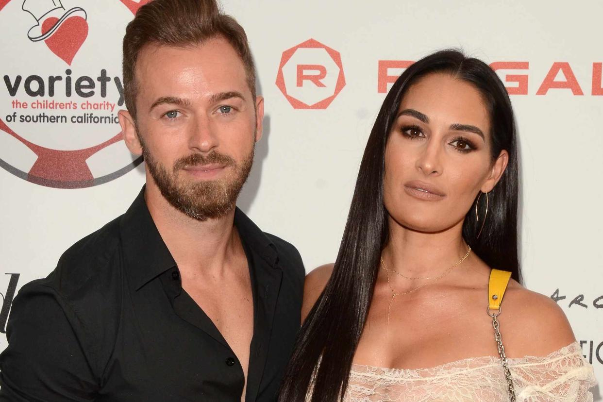 <p>MediaPunch/Shutterstock</p> From left: Artem Chigvintsev and Nikki Bella at the 9th Annual Variety Charity Poker & Casino Night on July 24, 2019