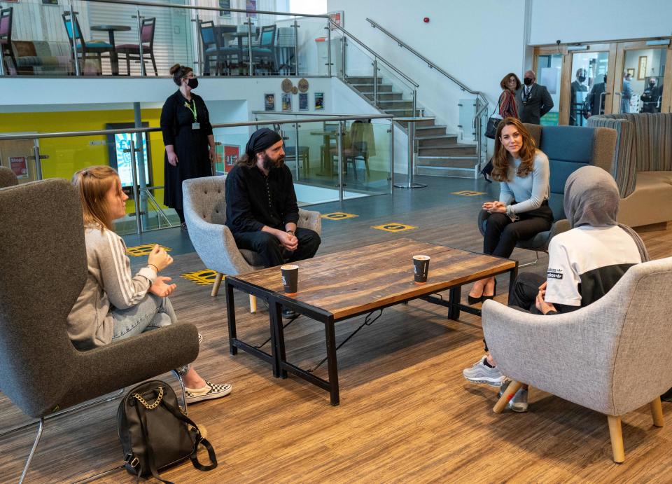 Britain's Catherine, Duchess of Cambridge chats with students during her visit to the University of Derby in Derby, central England, on October 6, 2020, where she met students to hear how the novel coronavirus COVID-19 pandemic has impacted university life, and what national measures have been put in place to support student mental health. (Photo by Arthur EDWARDS / POOL / AFP) (Photo by ARTHUR EDWARDS/POOL/AFP via Getty Images)