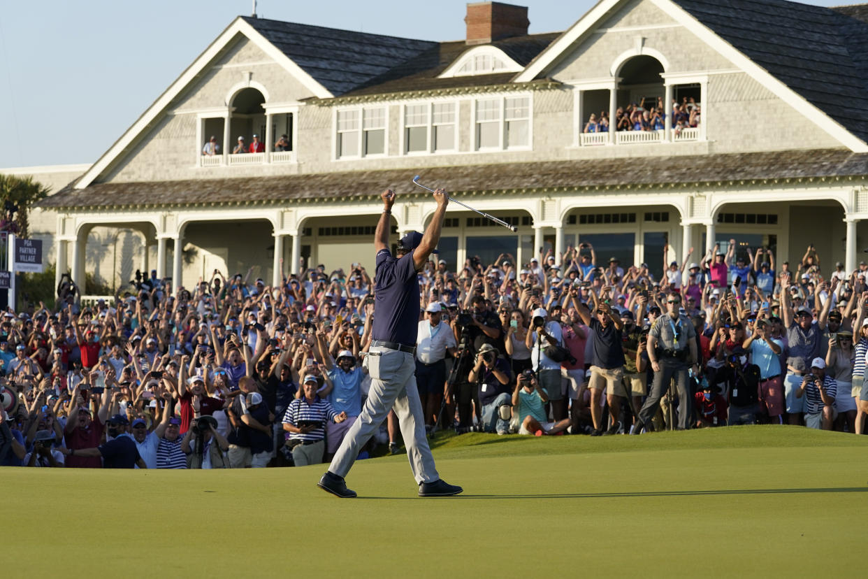 A maskless crowd cheers as Phil Mickelson celebrates after winning the final round at the PGA Championship golf tournament on the Ocean Course on Sunday, May 23, 2021, in Kiawah Island, S.C. (Matt York/AP)