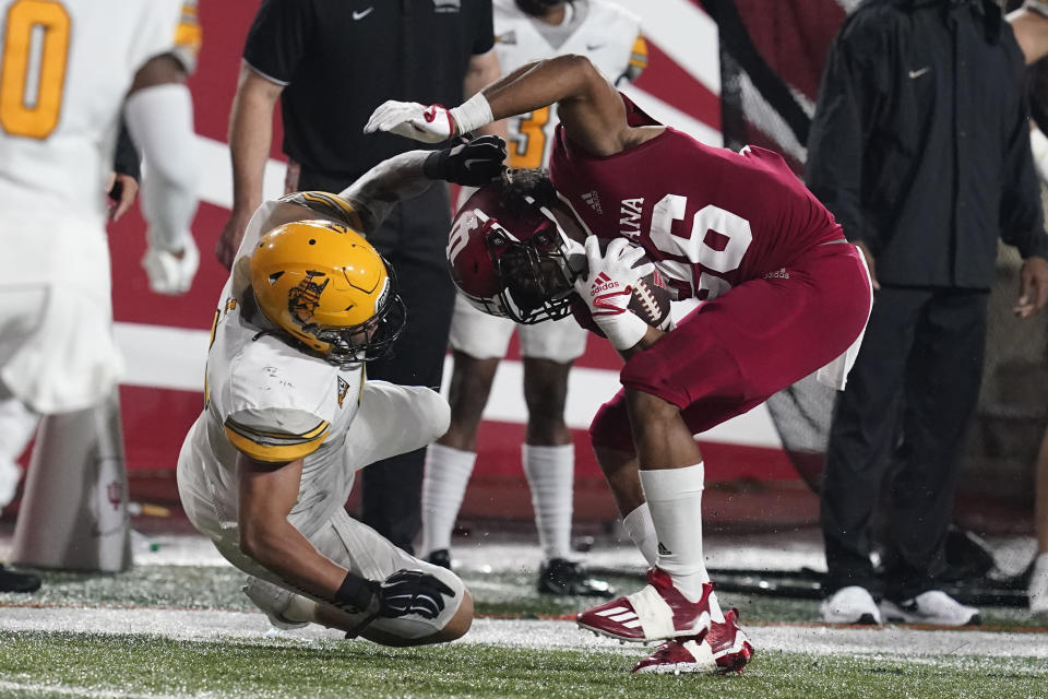 Indiana running back Josh Henderson (26) is tackled by Idaho linebacker Fa'Avae Fa'Avae during the first half of an NCAA college football game Saturday, Sept. 10, 2022, in Bloomington, Ind. (AP Photo/Darron Cummings)