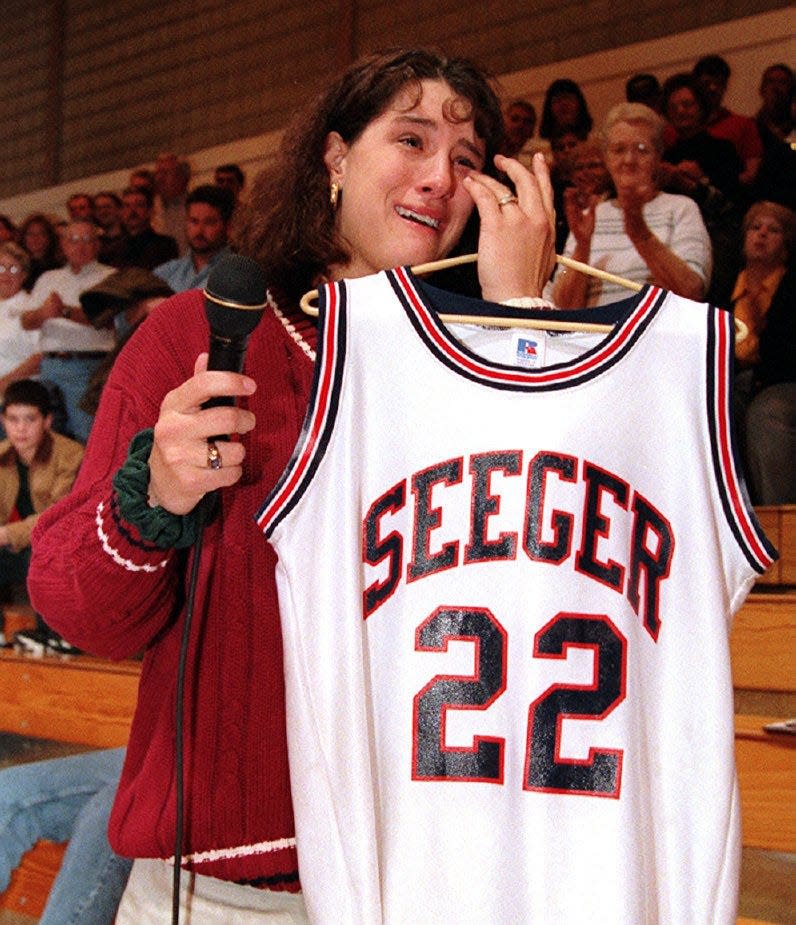 Stephanie White tearfully thanks her Seeger High School fans during a ceremony retiring her number Friday night at the West Lebanon school. White was last years Indiana Miss Basketball and the high school national player of the year. Fans yelled go Purdue to White near the end of the ceremony as she gets ready to start her regular season college career when her Boilermakers take on Kansas on November 26.