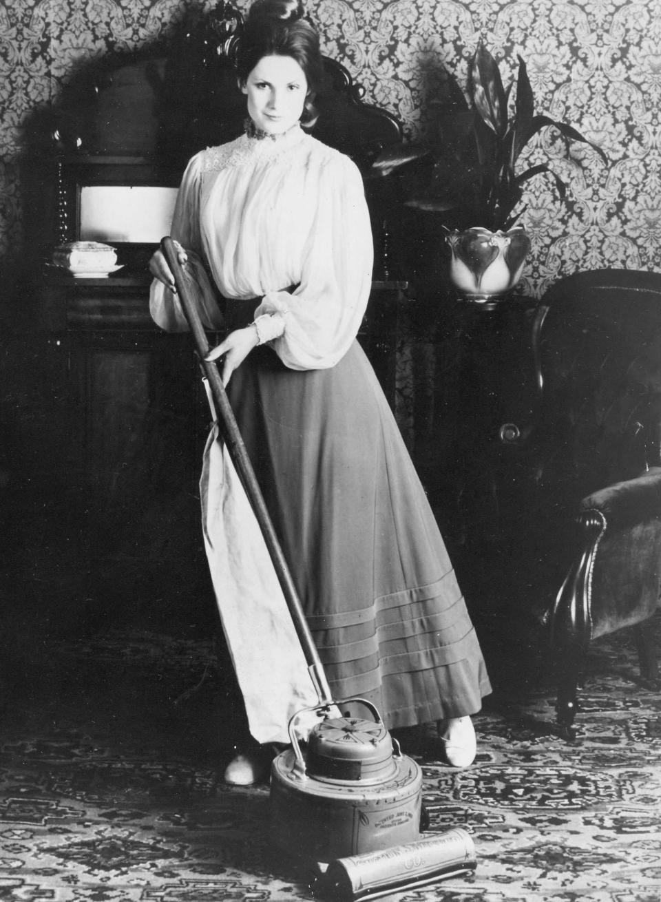 The first vacuum cleaners appeared in 1901 - the model pictured is from between 1910 and 1930. Robinson says, "The humble hoover has liberated people from back-breaking drudgery.  They allowed middle class people to live as respectably as they liked without the need for servants.  I remember our first stand-up vacuum – they were only introduced after World War II. It was taller than me. " (Image: Mirrorpix)