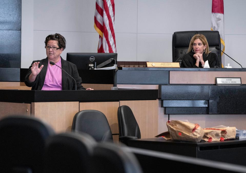 Forensic expert Anna Cox, left, testifies next to Judge Daliah H. Weiss during the trial of Ruby Martinez at the Palm Beach County Courthouse in West Palm Beach, Florida on May 17, 2023. Martinez faces charges of manslaughter with a firearm and tampering with physical evidence in the death of Jamal Francis in 2017.