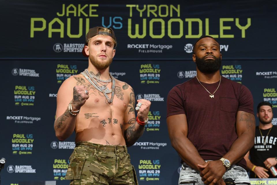 Jake Paul, left, and Tyron Woodley meeting in advance of Sunday's fight in Cleveland.