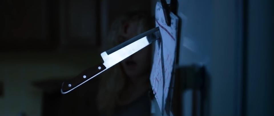 A scared woman narrowly avoid a thrown knife in her kitchen in "Apartment 212"