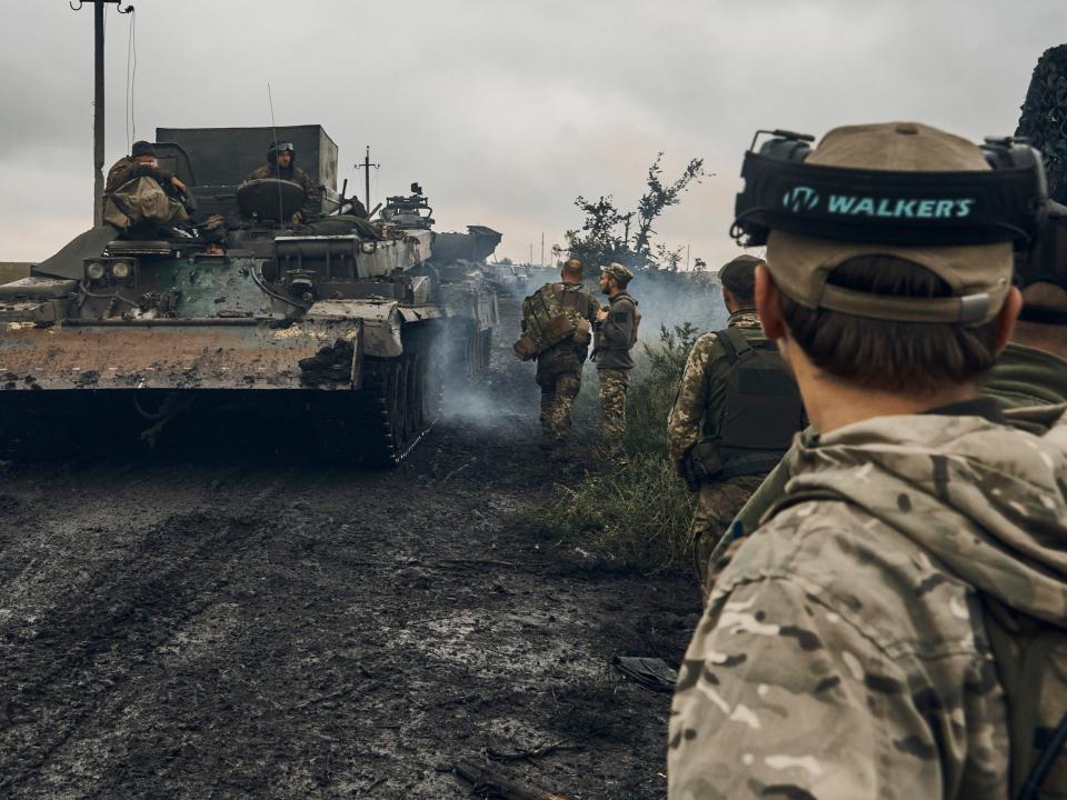 Ukrainian military vehicles move on the road in the freed territory in the Kharkiv region, Ukraine, Monday, Sept. 12, 2022.