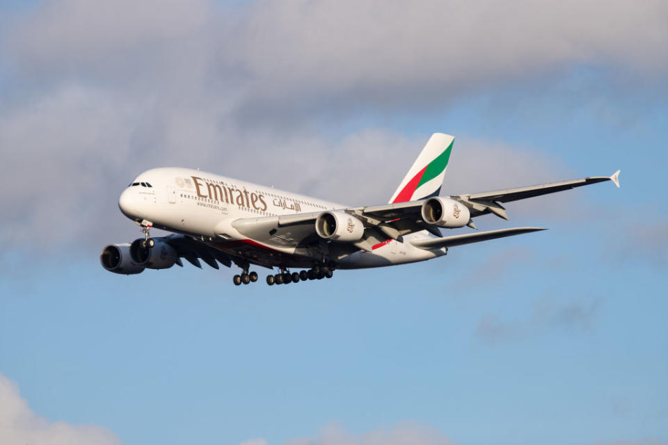 Emirates Airbus A380-800 airplane with registration A6-EEE landing at Amsterdam Schiphol AMS EHAM International Airport in a blue sky with clouds day. Emirates EK or UAE is the large airline in the Middle East and larger Airbus A380 double decker aircraft operator. Emirates connects Amsterdam with DXB OMDB Dubai International Airport daily as it is their hub. The airline is owned by the government of Dubai, United Arab Emirates. Source: Getty