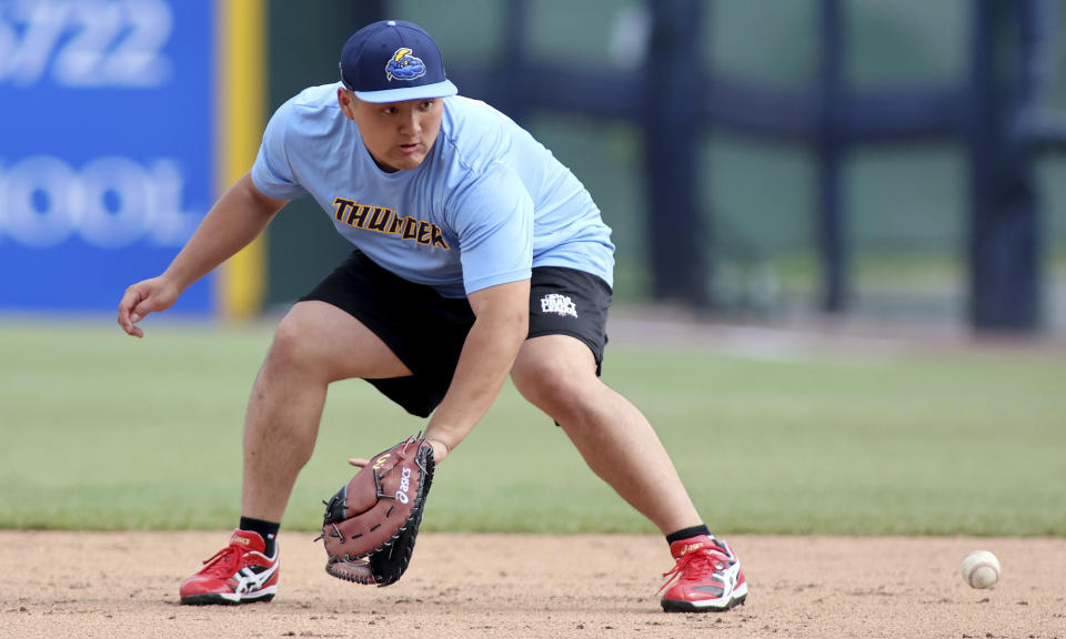 Trenton Thunder first baseman Rintaro Sasaki (49) fields a ground ball before a baseball game against the Frederick Keys, Tuesday, June 11, 2024, in Frederick, Md. The 19-year-old prospect will make his U.S. debut Tuesday in the MLB Draft League, playing for the Trenton Thunder of New Jersey along with others hoping to one day develop into major leaguers.(AP Photo/Daniel Kucin Jr.)