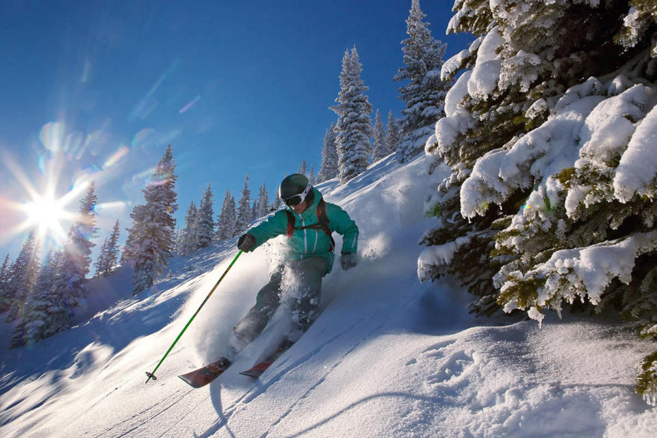 This Dec. 15, 2011 photo provided by Colorado Ski Country USA shows a skier making his way down the slopes in Aspen, Colo. A disappointing snow year in much of Colorado ski country last season has the state's resorts and hotels hoping that snowboarders and skiers will burn off some pent-up demand for deep snow this winter. (AP Photo/Colorado Ski Country USA/Jeremy Swanson)