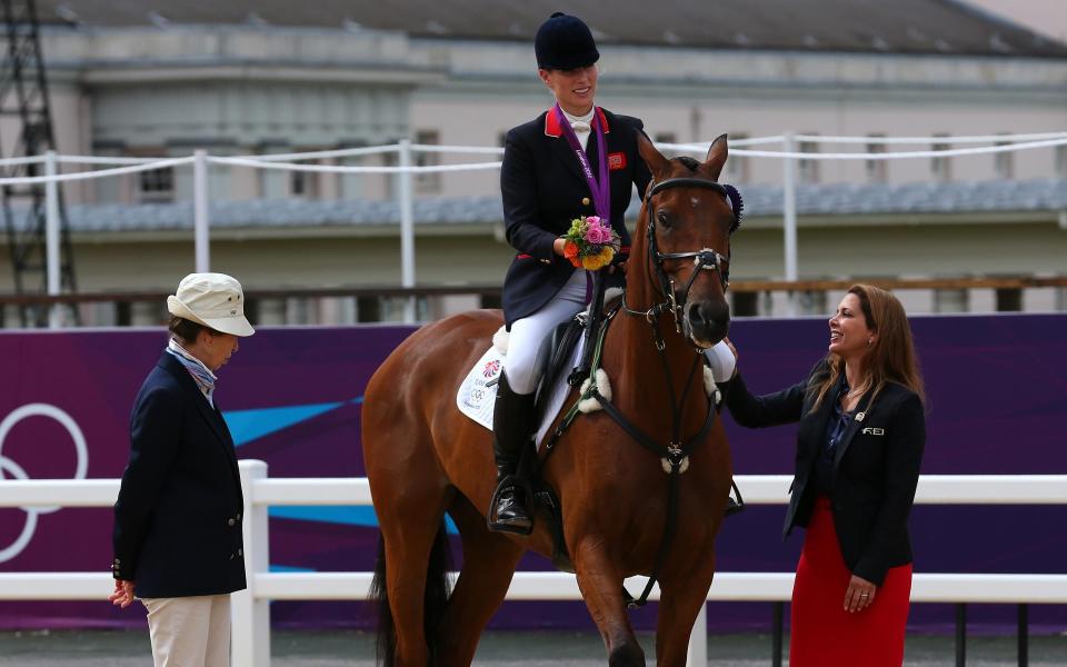 Zara Phillips speaks to her mother, Princess Anne after receiving a silver medal on Day 4 of the London 2012 Olympic Games 