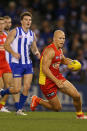 Gary Ablett's fourth quarter explosion led the Suns to victory, holding off North's comeback.