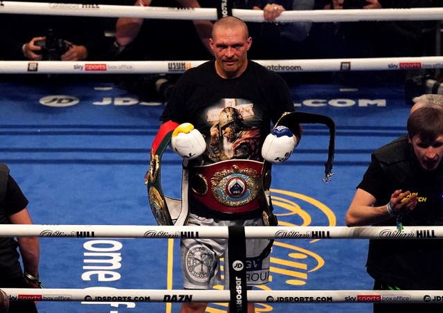 Oleksandr Usyk celebrates his win