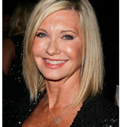 <div class="caption-credit"> Photo by: Getty images</div>She's as adorable now as she was when she debuted as Sandy in the movie <i>Grease</i>, but it looks like Australian singer and actress Olivia Newton John spent a little too much time under the Aussie sun. After years of skipping sunscreen on her neck, the sunspots on her chest are hard to hide as seen here at the opening of <i>The Star</i> in Sydney on September 15, 2011.