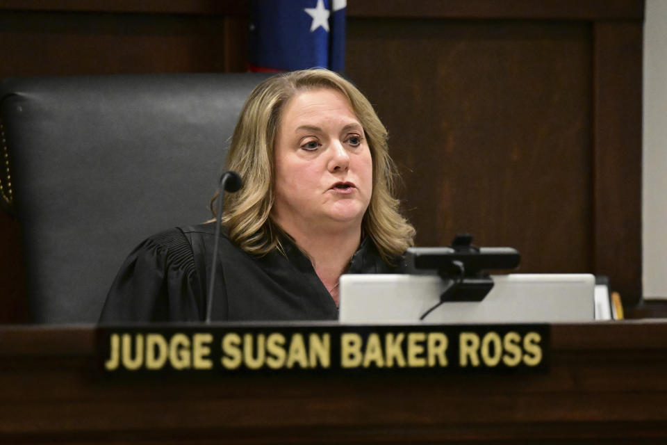Judge Susan Baker Ross talks inside the courtroom at the Summit County courthouse in Akron, Ohio on Tuesday, Feb. 13, 2024. Two fired executives of FirstEnergy Corp. and a former top state utilities regulator pleaded not guilty Tuesday to state charges related to a $60 million bribery scheme that centered on securing a legislative bailout for two Ohio nuclear power plants with the help of a powerful House speaker. (AP Photo/David Dermer)
