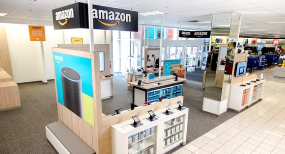 A collection of Amazon devices displayed in the front of a Kohl's store