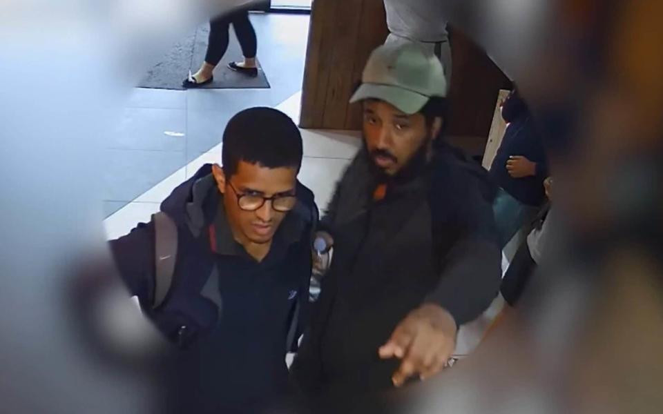 CCTV issued by the Metropolitan Police showing Sahayb Abu, 27 and Muhamed Abu, 32, in a fast food restaurant - PA