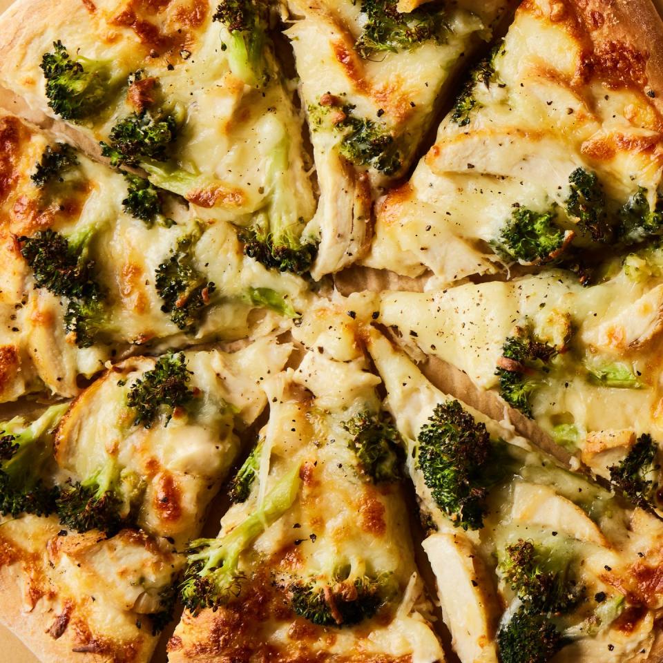 chicken broccoli alfredo pizza cut into slices