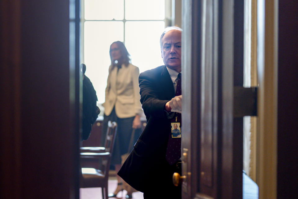 Steve Ricchetti, counselor to President Joe Biden, shuts the door to a meeting with House Speaker Kevin McCarthy's emissaries during negotiations over the debt limit crisis at the Capitol in Washington, Friday, May 19, 2023. / Credit: J. Scott Applewhite / AP