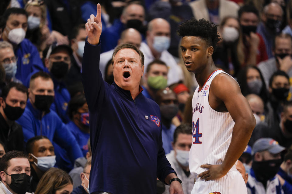 LAWRENCE, KS - FEBRUARY 12: Head coach Bill Self of the Kansas Jayhawks calls a play while conversing with K.J. Adams #24 of the Kansas Jayhawks while taking on the Oklahoma Sooners during the first half at Allen Fieldhouse on February 12, 2022 in Lawrence, Kansas. (Photo by Kyle Rivas/Getty Images)