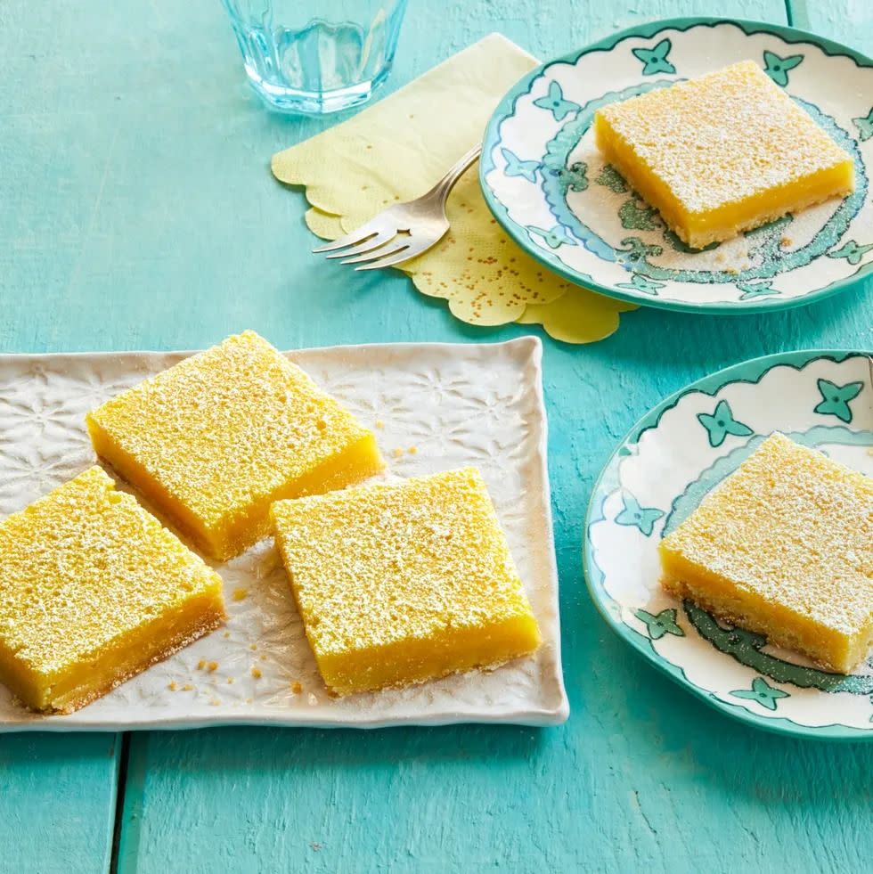 lemon bars on teal wood background