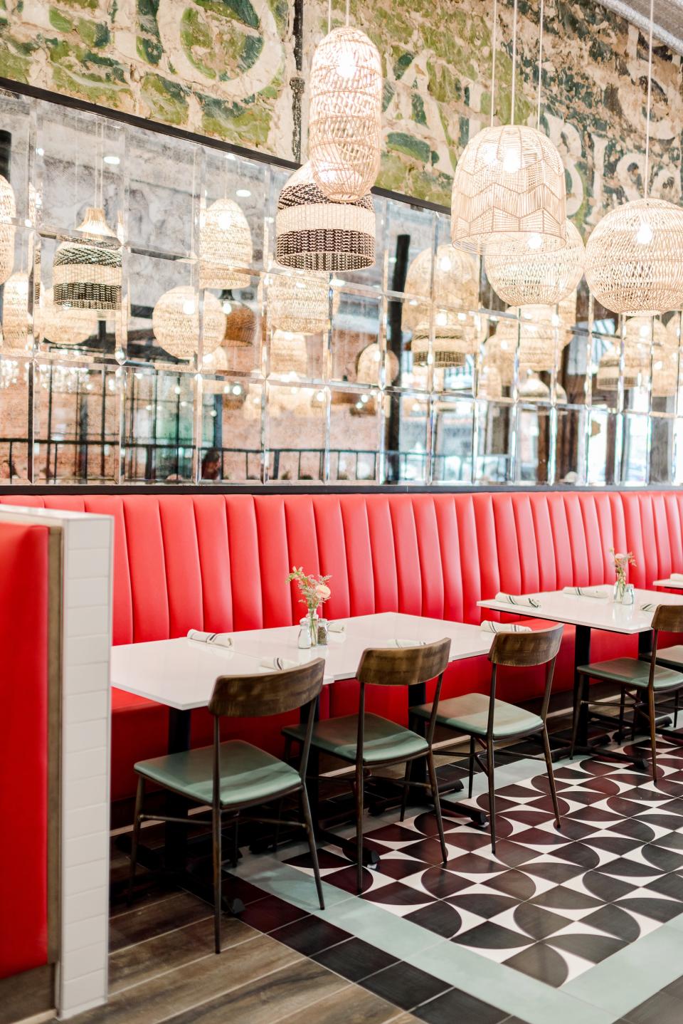 New seating and lighting are pictured alongside the original mural from the 1910s at The Pioneer Woman Mercantile restaurant in Pawhuska.