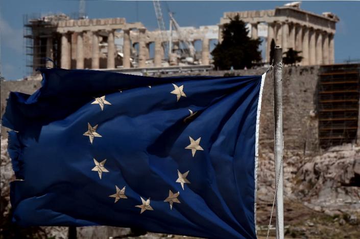 Eurozone finance ministers are urging Greece to swiftly implement the tough reforms at the heart of its huge bailout (AFP Photo/Aris Messinis)