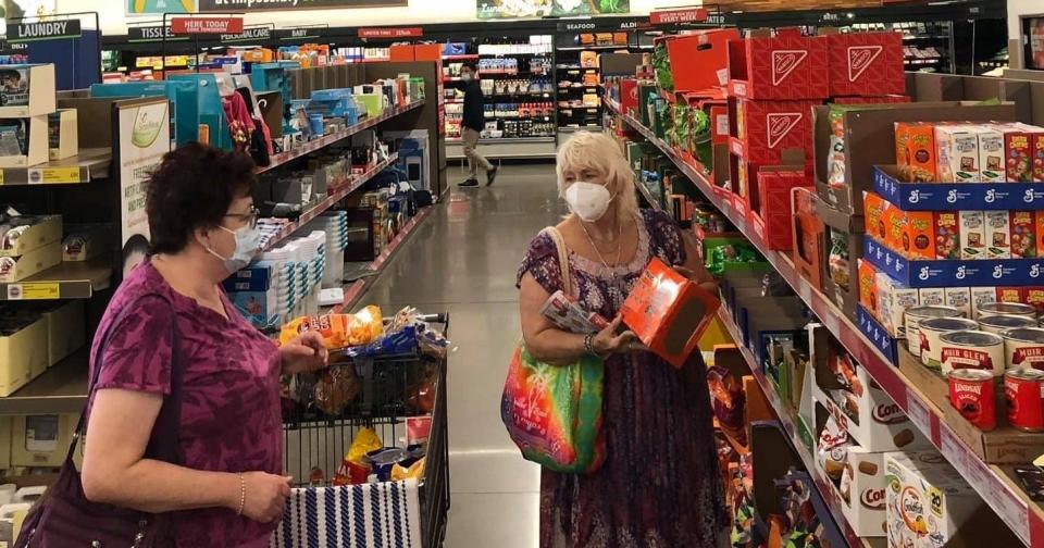 From left to right, friends Angelia Higgins and Christine Mosconi shop together in the Aldi "Aisle of Shame" in Chester.