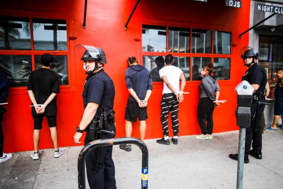 Police detain people during the George Floyd protests in Los Angeles on 1 June 2020.