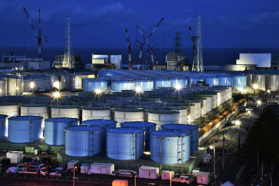 FILE - This Jan. 25, 2019, file photo shows water tanks containing contaminated water that has been treated at the Fukushima Dai-ichi nuclear plant in Okuma town, Fukushima prefecture, northeastern Japan. Japan has reassured foreign diplomats about the crippled Fukushima nuclear plant's safety amid concerns about massive amounts of treated but radioactive water stored in tanks. Diplomats from 22 countries, including South Korea, attended a briefing Wednesday, Sept. 4, 2019, where Japanese officials stressed the importance of combating rumors.(Kyodo News via AP, File)