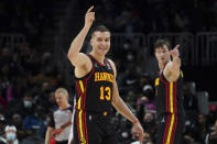 Atlanta Hawks guard Bogdan Bogdanovic (13) reacts after a Hawks basket in the second half of an NBA basketball game against the Sacramento Kings Wednesday, Jan. 26, 2022, in Atlanta. (AP Photo/John Bazemore)