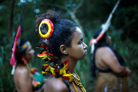 Indigenous people from the Pataxo Ha-ha-hae tribe walk to Paraopeba river, after a tailings dam owned by Brazilian mining company Vale SA collapsed, in Sao Joaquim de Bicas near Brumadinho, Brazil January 28, 2019. REUTERS/Adriano Machado