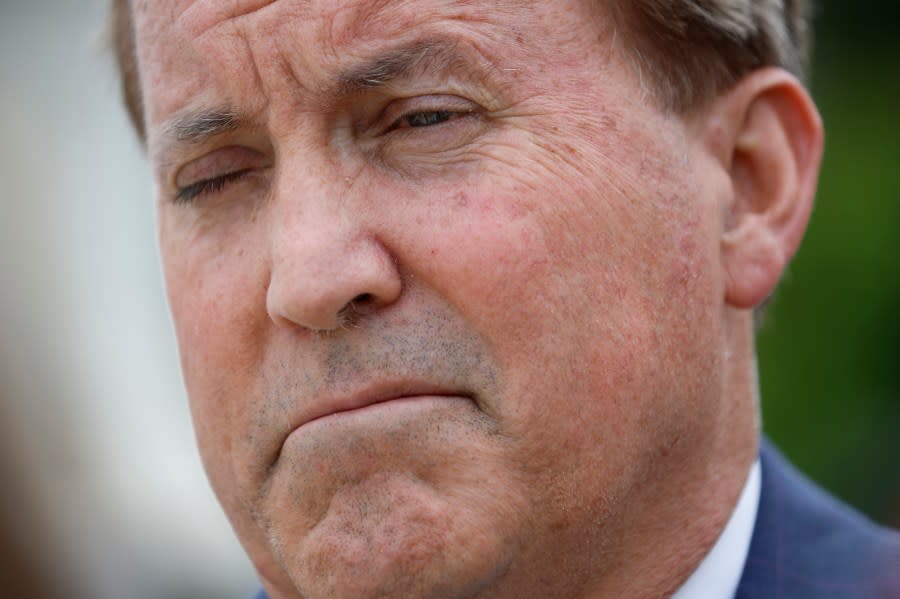 Texas Attorney General Ken Paxton talks to reporters after the U.S. Supreme Court heard arguments in a case Texas brought against the Biden Administration about Title 42 on April 26, 2022 in Washington, DC. (Photo by Chip Somodevilla/Getty Images)