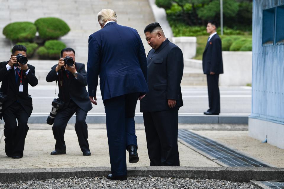 With dictator Kim Jong Un, President Donald Trump crosses the Demilitarized Zone into North Korea on June 30, 2019.