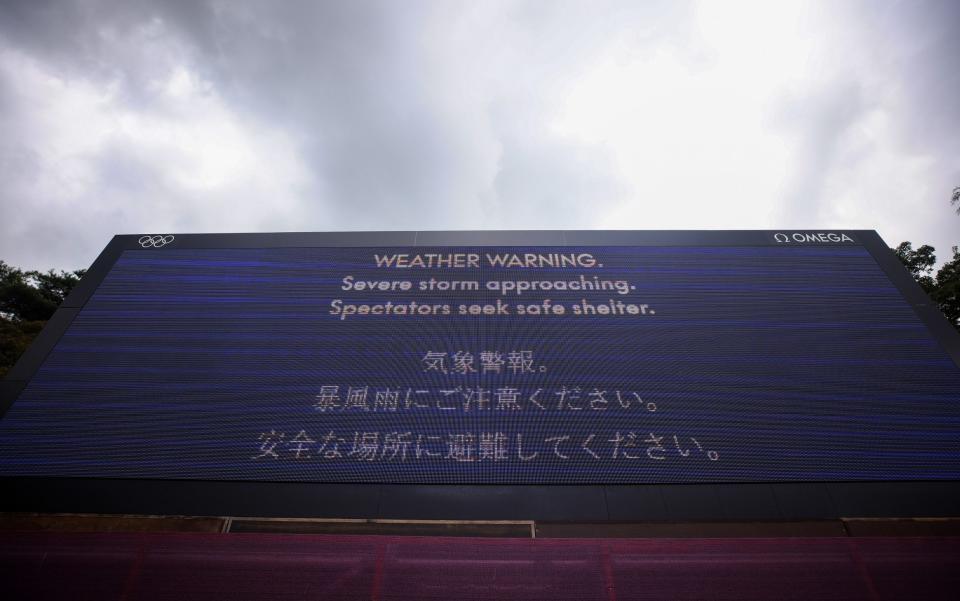 A weather warning sign is seen as play is suspended due to inclement weather during the final round of the Women's Individual Stroke Play on day fifteen of the Tokyo 2020 Olympic Games at Kasumigaseki Country Club on August 07, 2021 in Kawagoe, Japan. - Mike Ehrmann/Getty Images