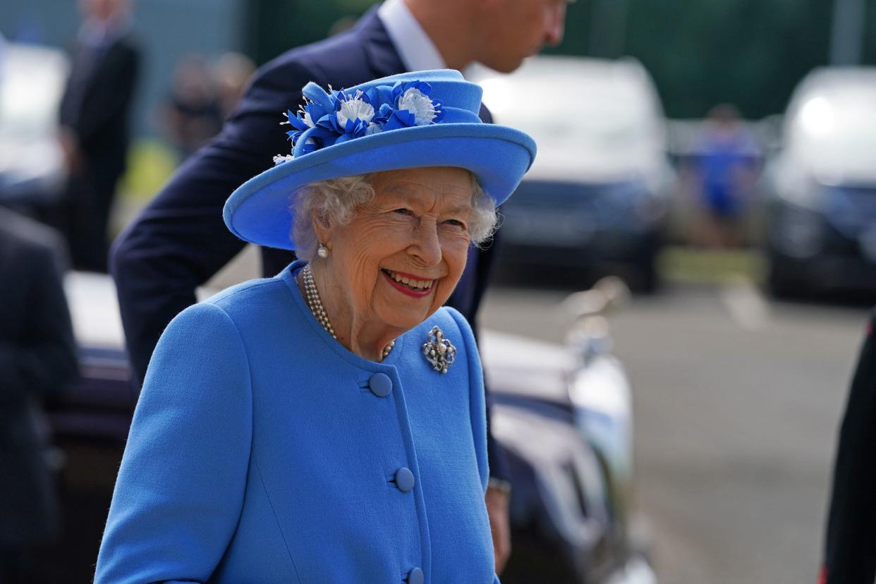 Britain's Queen Elizabeth II smiles as she arrives for a visit to AG Barr's factory in Cumbernauld, east of Glasgow, where the Irn-Bru drink is manufactured on June 28, 2021. - The Queen is in Scotland for Royal Week where she will be undertaking a range of engagements celebrating community, innovation and history. (Photo by Andrew Milligan / POOL / AFP) (Photo by ANDREW MILLIGAN/POOL/AFP via Getty Images)