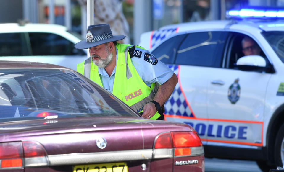 Police are seen stopping cars at a check point during a Covid lockdown. The new road rule comes in on September 16.