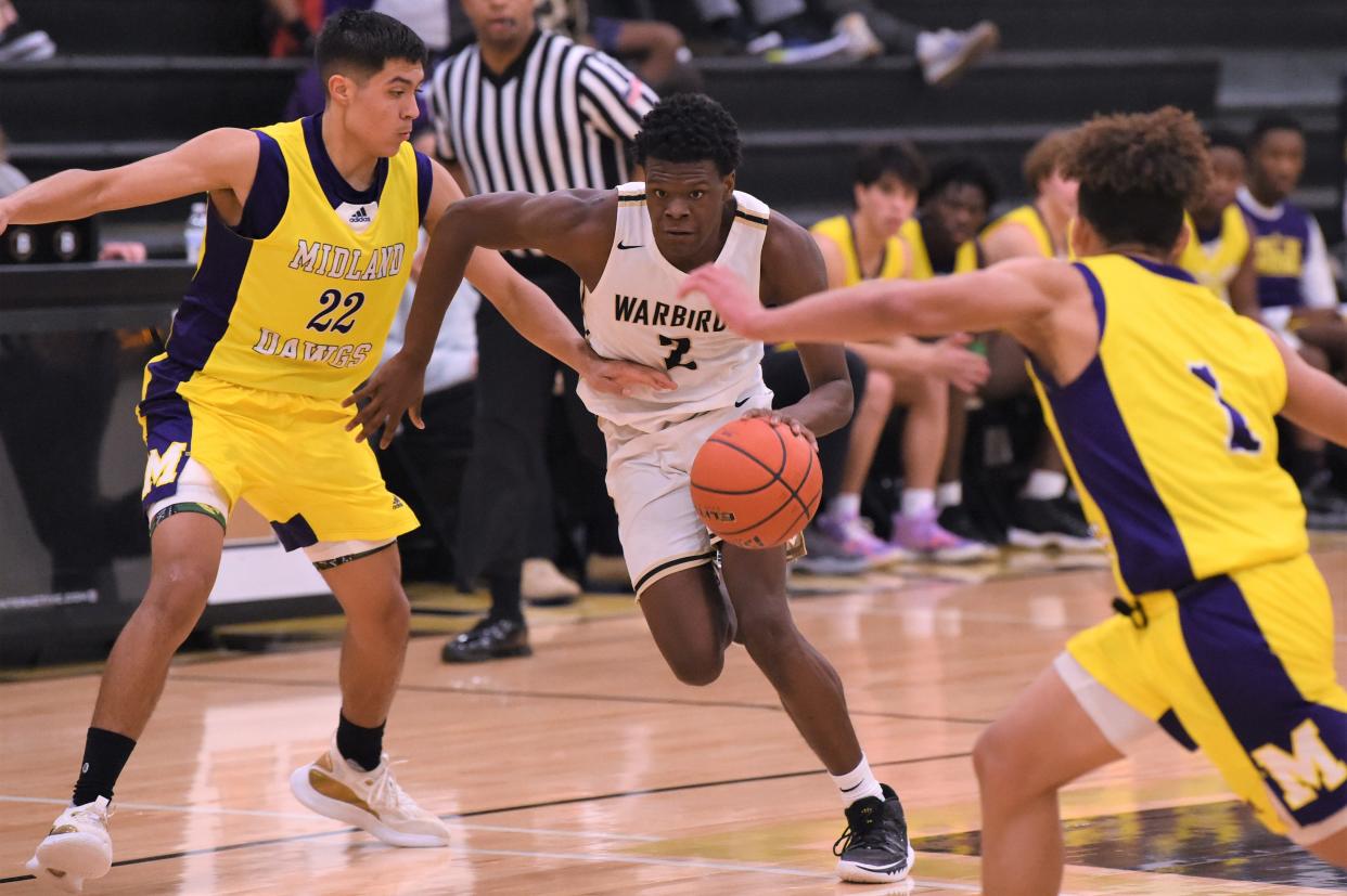 Abilene High's Jeremiah Talib (2) drives past a defender during Tuesday's game against Midland High at Eagle Gym. The Eagles, who won the District 2-6A game, play at San Angelo Central on Friday in a league game.