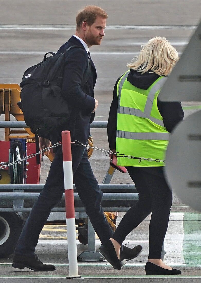 The Duke of Sussex boards a plane at Aberdeen Airport as he travels to London following the death of Queen Elizabeth II on Thursday. Picture date: Friday September 9, 2022.